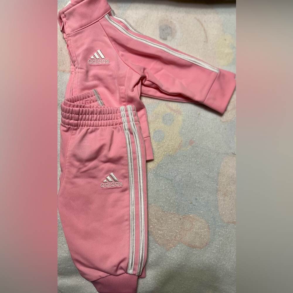 Nice like new Adidas outfit pink white lines down the and leg only been worn onc